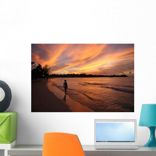 fiery sunset over the water in jamaica Wall Mural