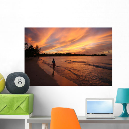 fiery sunset over the water in jamaica Wall Mural
