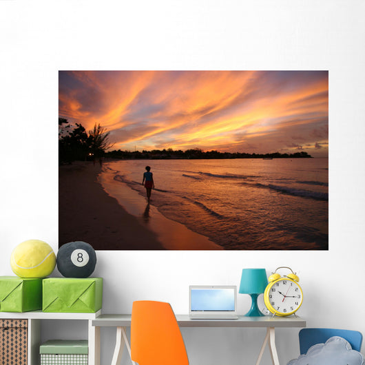 fiery sunset over the water in jamaica Wall Mural