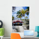Old car on a tropical beach Wall Mural