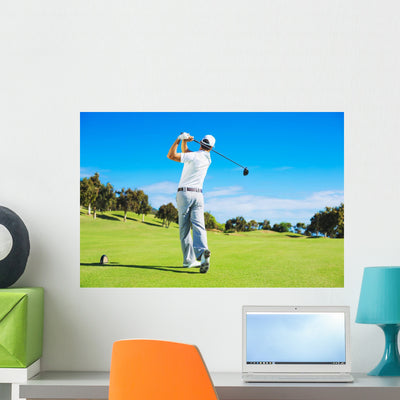 Man Playing Golf Wall Decal shown on a wall