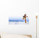 Funny giraffe with sunglasses coming out of the clouds Wall Mural