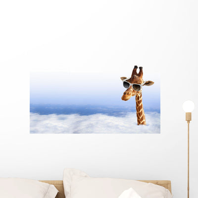 Funny Giraffe With Sunglasses Coming Out Of The Clouds Wall Decal shown on a wall