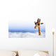 Funny giraffe with sunglasses coming out of the clouds Wall Mural