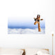 Funny giraffe with sunglasses coming out of the clouds Wall Mural