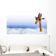 Funny giraffe with sunglasses coming out of the clouds Wall Mural
