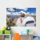 Happy Senior Couple Looking Out Over The Grand Canyon Wall Mural