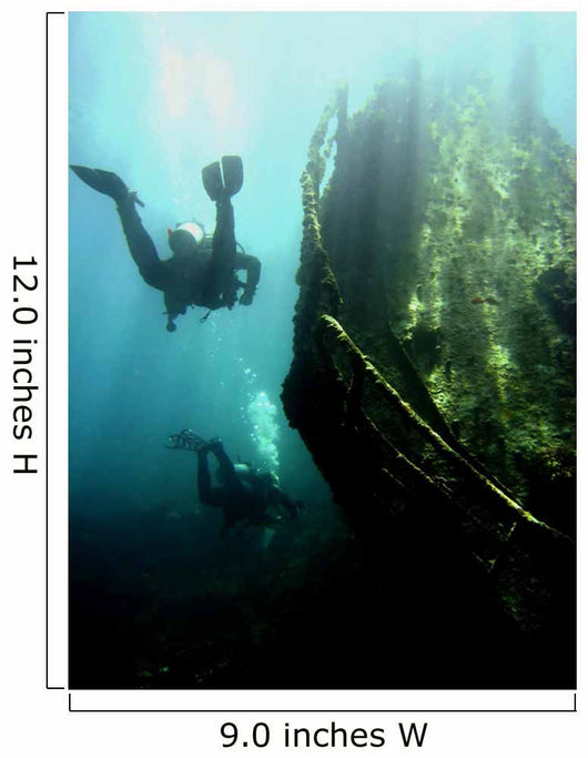 Wreck with sunbeams showing bow of boat and divers Wall Mural