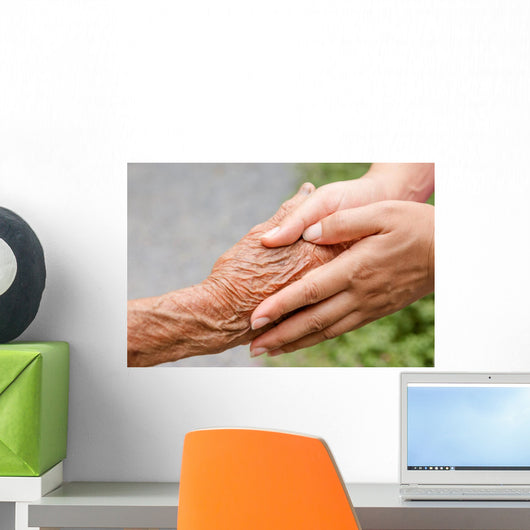Senior and young holding hands with retro effect Wall Mural