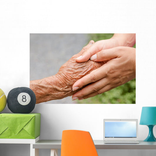 Senior and young holding hands with retro effect Wall Mural