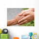 Senior and young holding hands with retro effect Wall Mural