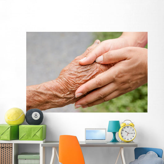 Senior and young holding hands with retro effect Wall Mural
