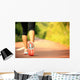 young fitness woman legs walking on forest trail  Wall Mural