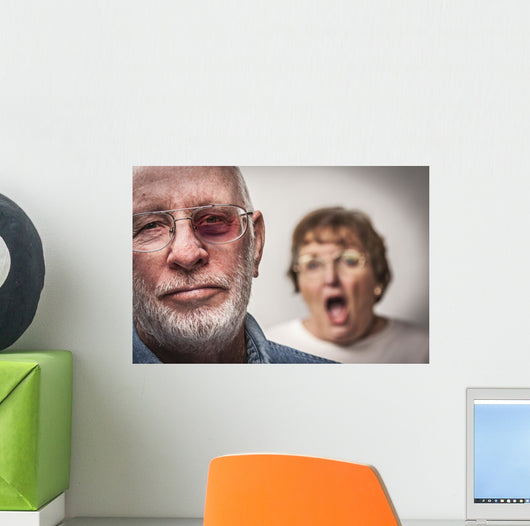 Battered and Scared Man with Screaming Woman Behind Wall Mural