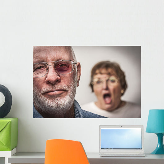 Battered and Scared Man with Screaming Woman Behind Wall Mural