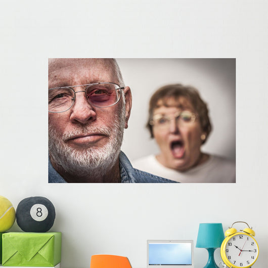 Battered and Scared Man with Screaming Woman Behind Wall Mural