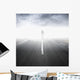 Asphalt highway perspective with walking man in the fog Wall Mural