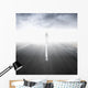 Asphalt highway perspective with walking man in the fog Wall Mural