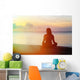 woman meditation on the beach Wall Mural