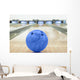 Balls on bowling alley against ten pins Wall Mural