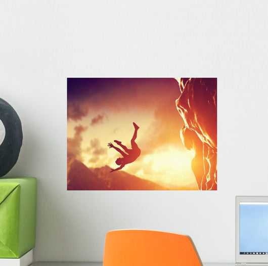 Hiker free falling from the mountain. Man in fatal situation Wall Mural