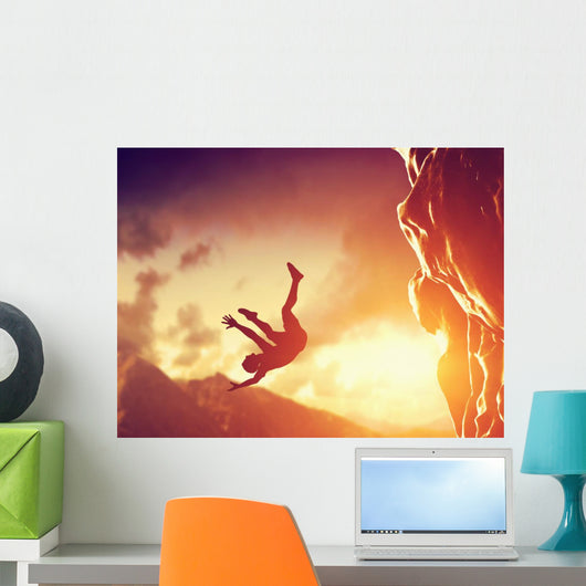 Hiker free falling from the mountain. Man in fatal situation Wall Mural