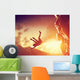 Hiker free falling from the mountain. Man in fatal situation Wall Mural
