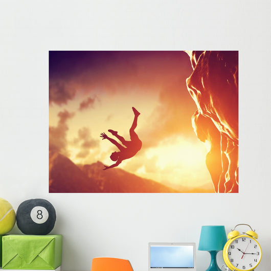 Hiker free falling from the mountain. Man in fatal situation Wall Mural