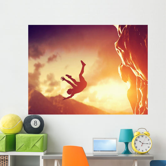 Hiker free falling from the mountain. Man in fatal situation Wall Mural
