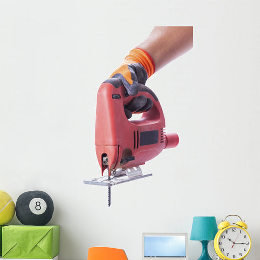 hand in a glove holds a working electric jig saw Wall Decal