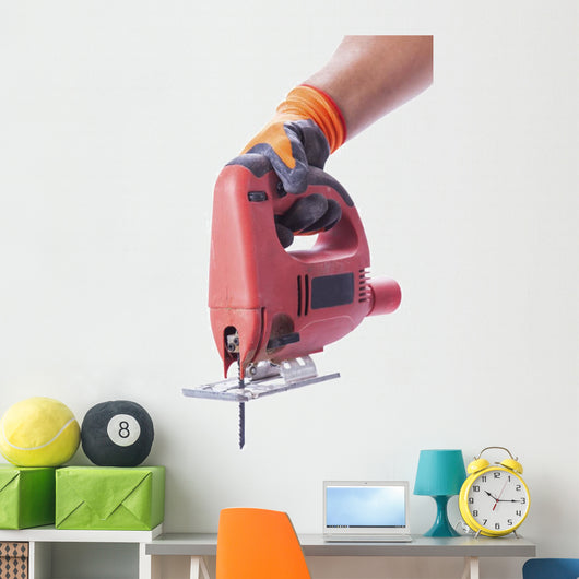 hand in a glove holds a working electric jig saw Wall Decal