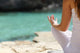 Detail Of A Woman Hand Doing Yoga Exercises On The Beach Wall Decal