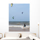Unidentified people during demonstration of kitesurfing Wall Mural