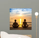 Young Couple Practicing Yoga On Sea Beach. Wall Decal