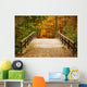 Bridge in autumn forest Wall Mural