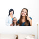 Teen girl pointing at dental barces with doctor in background. Wall Mural