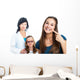 Teen girl pointing at dental barces with doctor in background. Wall Mural