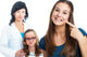 Teen Girl Pointing At Dental Braces With Doctor In Background. Wall Decal