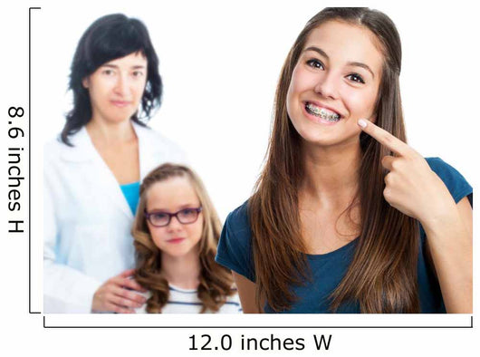 Teen girl pointing at dental barces with doctor in background. Wall Mural