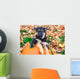 German Shepherd puppy sitting on pumpkins Wall Mural