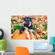 German Shepherd puppy sitting on pumpkins Wall Mural