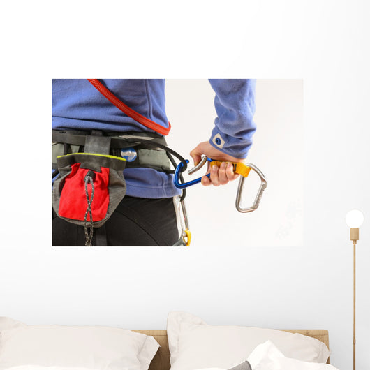 Woman wearing climbing equipment Wall Mural