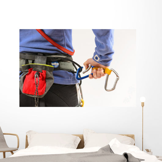 Woman wearing climbing equipment Wall Mural