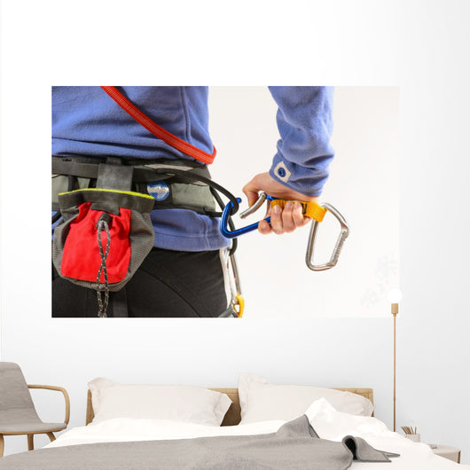 Woman wearing climbing equipment Wall Mural