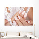 Beautiful woman's nails with french manicure. Wall Mural