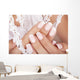 Beautiful woman's nails with french manicure. Wall Mural