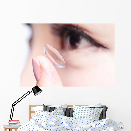 human eye and contact lens Wall Mural