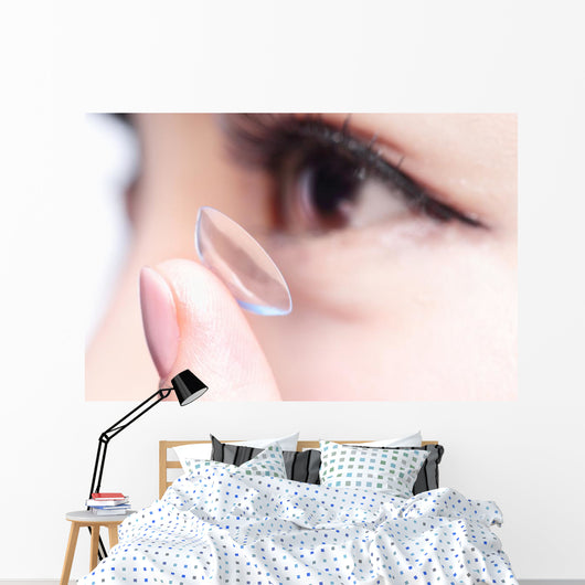 human eye and contact lens Wall Mural