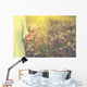 Woman with bunch of dandelion flowers in hand Wall Mural