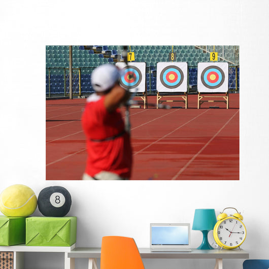 Bow and arrow in the hands of an archer Wall Mural